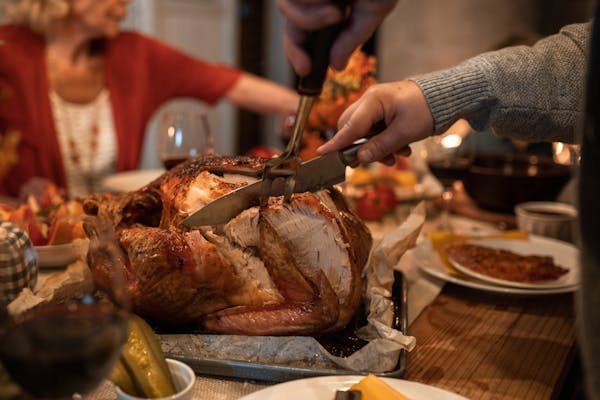 Cutting the turkey at a Friendsgiving